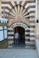 person walking in front of a church