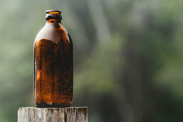 Empty stubby beer bottle with copy space