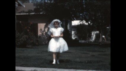 The First Communicant 1966 - A girl is ready for her first communion in Canoga Park, California in 1966. 
