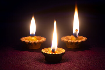 Clay diya lamps lit during diwali celebration. Indian festival diwali