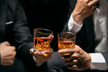 Businessmen in suits drinking  Celebrate whiskey