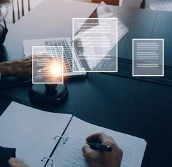 Justice and law concept.Male judge in a courtroom with the gavel, working with, computer and...