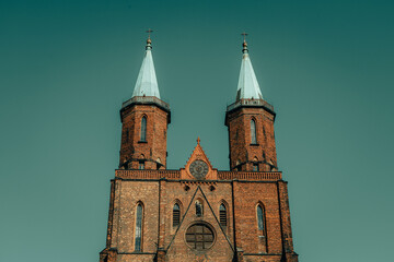 Fototapeta na wymiar old church towers against the sky