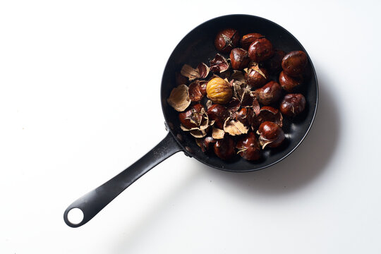 Roasted chestnuts in a pan