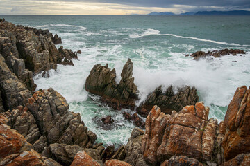 The rocky coastline of Walker Bay at De Kelders near Gansbaai in the Overberg, Western Cape. South Africa