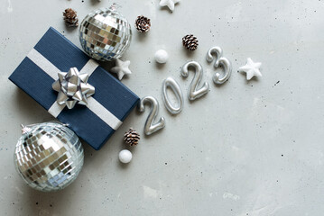 Happy New Year 2023 decorate with LED cotton ball on wooden background