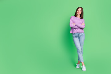 Fototapeta premium Full length photo of young attractive gorgeous pretty girl wear stylish clothes folded hands recommend new shopping deal isolated on green color background
