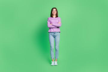 Fototapeta na wymiar Full length photo of young gorgeous pretty nice attractive girlish lady folded hands confident leader crossed hands isolated on green color background