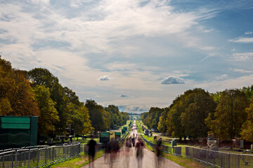 Daytime long exposure of people walking on The Long Walk in Great Windsor Park - 532480013