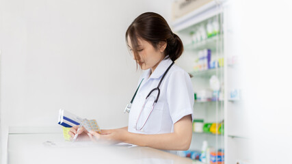 Pharmacist working in a pharmacy, Consultation and medical advice, All kinds of generic household drugs and pharmaceutical products on the shelf, Service and assistance to patients, Pharmacy.