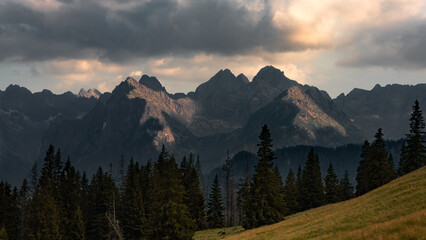 Fototapeta na wymiar National park of High Tatras in Poland, Landscape photography in the summer. Mountains peaks of Tatry Wysokie with moody conditions