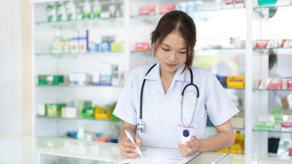 Pharmacists are listing prescription drugs, List Items in the clipboard, Working in a pharmacy or...