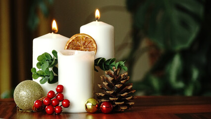 Christmas still life with candles and decorations