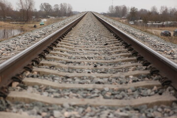 Fototapeta na wymiar Railroad tracks on a bright cloudy day.