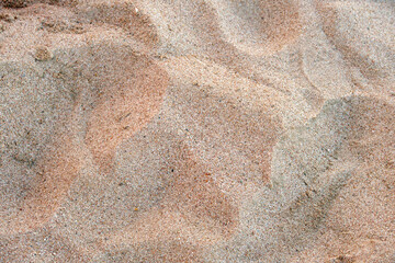 Flat view of clean yellow sand surface covering seaside beach. Sandy texture