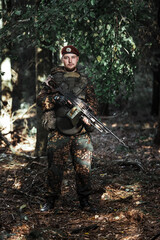 Portrait of an eastern special forces soldier with rifle