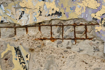 Old reinforced concrete structure with damaged and rusty metallic reinforcement that must be demolished - Metal bars rusty due to water infiltration into concrete
