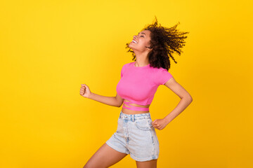 Fototapeta na wymiar Photo of excited pretty girl closed eyes chilling dancing have good mood isolated on yellow color background