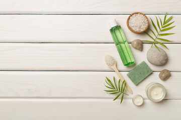 Composition with spa products on wooden background, top view