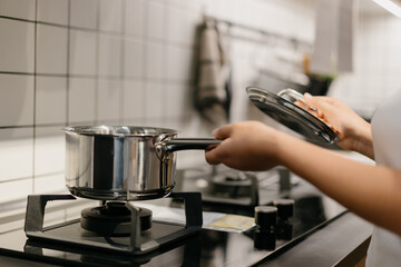 Asian woman is cooking in the kitchen