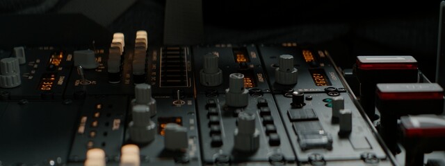 CU Commercial aircraft pilots adjusting radio channel parameters during the flight at high...
