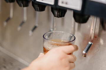 pouring water into a glass