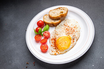 breakfast fried egg, tomato, healthy meal food snack on the table copy space food background 