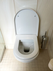 Close-up image of toilet bowl, white toilet in the bathroom.