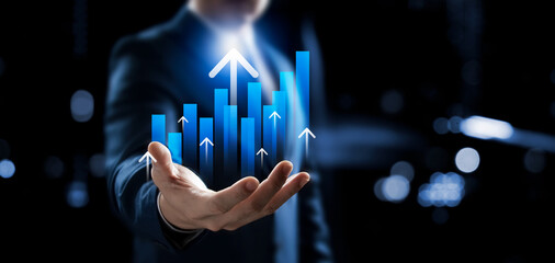 Businessman showing business growth graph, successful marketing strategy, up arrow and global...