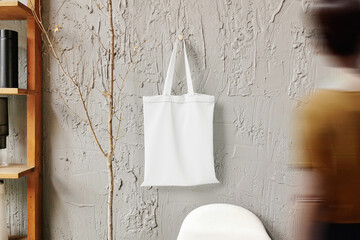 Clean minimal bag canvas hanging mockup on the wall with shelf and people walking blur foreground