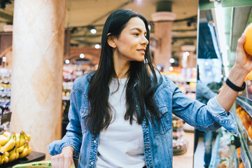 Happy brunette girl wearing casual outfit shopping