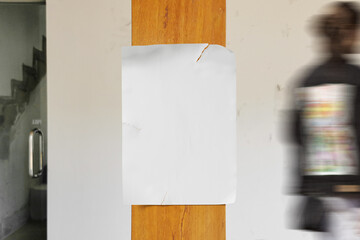 Clean minimal poster mockup on wooden pole with people walking
