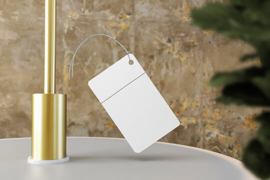 Clean minimal label mockup floating on lanp top with leaves