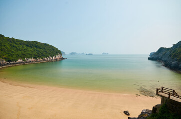 beautiful empty beach in the bay. empty beach with beautiful sand and turquoise water, surrounded by rocks. beautiful natural background