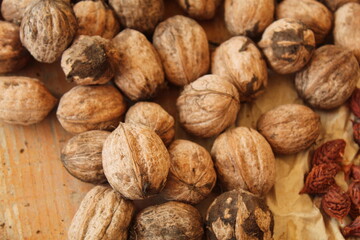 Some walnuts on a wooden bench