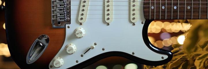 Banner of electric guitar sunburst tone and bokeh background