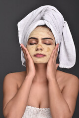 A young woman's face with home made face mask applied for skin care 