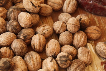 Some walnuts on a wooden bench
