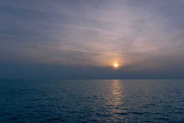 Nice sunset with clouds in the sea