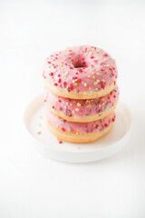 Pink donuts on a white background
