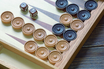 Game board for playing backgammon with dice and counters