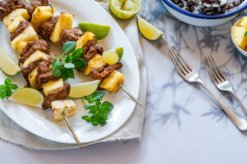 Jerk pork and pineapple skewers with black bean rice