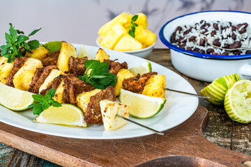 Jerk pork and pineapple skewers with black bean rice