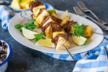 Jerk pork and pineapple skewers with black bean rice