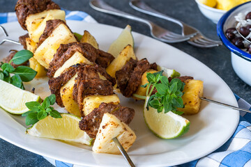 Jerk pork and pineapple skewers with black bean rice