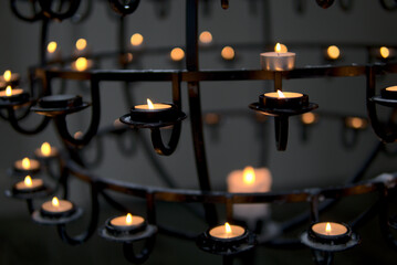 Black steel lamp with candles in medieval style