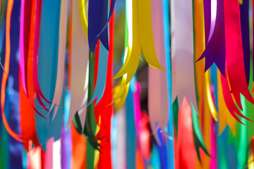 multi colored ribbon backdrops are hung to represent lgbtq community to call for queer equality and rainbow backdrop formed by multi colored ribbons and Copy Space for messages. LGBT concept