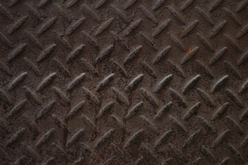 The background of the embossed steel sheet is rusting because it is installed outside the building, causing it to be damaged by the weather and rusting on the surface.Copy Space for Text