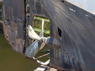 propeller and rudder on old steel hulled steamer © Paul