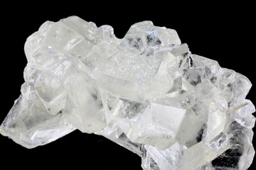 Crystal stone uncut on a black background